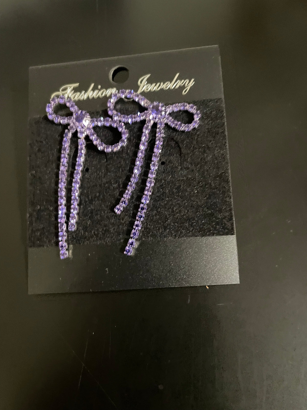 purple bowtie earring
